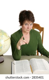 A Stern Looking Teacher Or Librarian Shaking Her Finger At You.  Isolated On White.