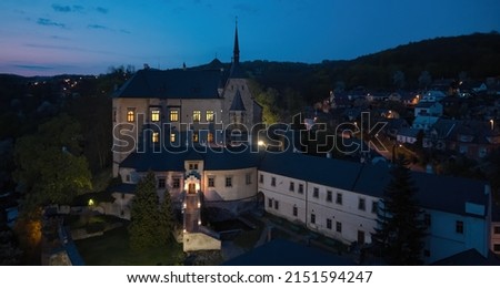 Sternberk Castle illuminated by lamps and evening lights in background. Sternberk, medieval mansion,  Olomouc region, Moravia, Czech republic.