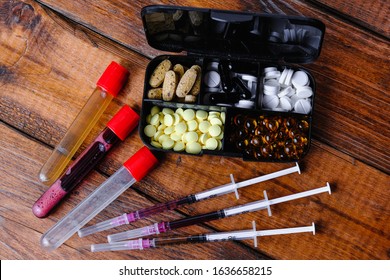 Steroid medication and sport nutrition composition on a wooden background