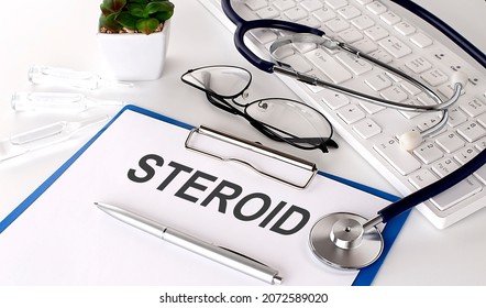 STEROID Text On White Paper On The White Background. Stethoscope ,glasses And Keyboard