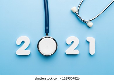 Stethoscope With 2021 Number On Blue Background. Happy New Year For Health Care And Medical Banner/calendar Cover. Creative Idea For New Trend In Medicine Treatment And Diagnosis Concept.