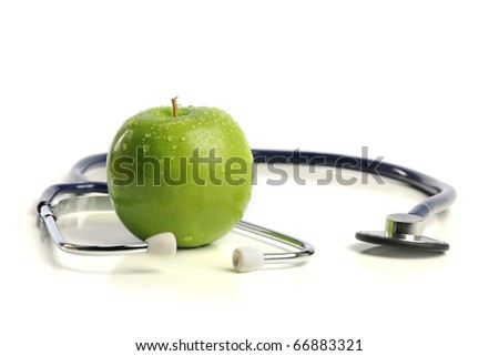 Stethoscope and Apple isolated on a white background