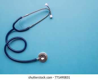 Stethoscope attributes medical,health care ,cardiac care on above blue background copy space top view