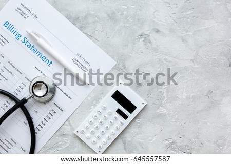 stethoscope, billing statement for doctor's work stone background top view space for text