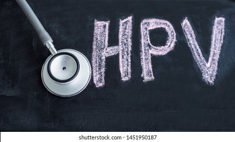 Stethoscope with blackboard  have text  " HPV" in it. Concept Prevent HPV infection by vaccination before getting infected.
