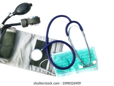 Stethoscope With Blood Pressure Cuff And Protective Mask On Isolated White Background In Medical  Instruments Concept 