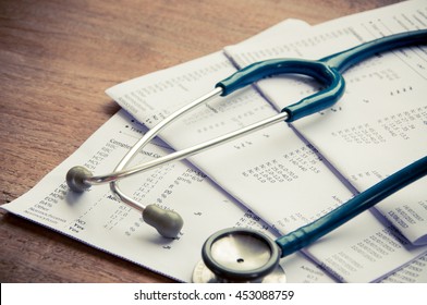 Stethoscope And Blood Test Results