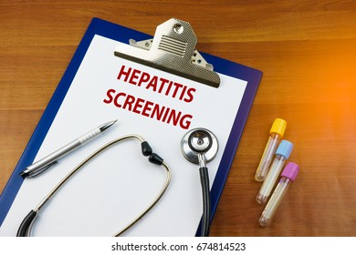 Stethoscope, Blood Tubes Test And A Clip Board With Text Hepatitis Screening. The Purpose Of Screening For Viral Hepatitis Is To Identify People Infected With The Disease As Early As Possible.