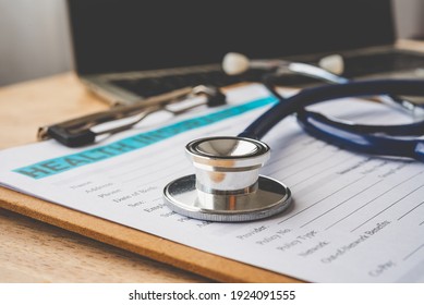 Stethoscope And Calculator Placed On Health Insurance Documents, Individual Medical Health Insurance. Concept Life Planning