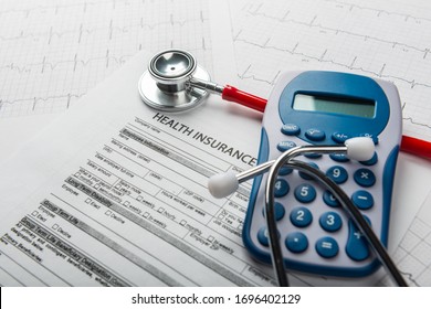  Stethoscope and calculator symbol for health care costs or medical insurance