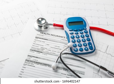  Stethoscope and calculator symbol for health care costs or medical insurance