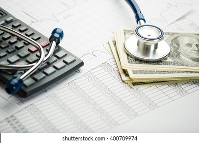  Stethoscope and calculator symbol for health care costs or medical insurance 
