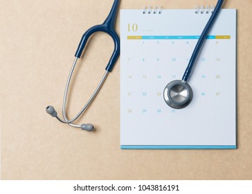 Stethoscope and a calendar. Doctor's appointment and service in the hospital. - Shutterstock ID 1043816191