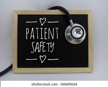 Stethoscope and Chalk board with inscription patient safety isolated on white background. Medical concept

