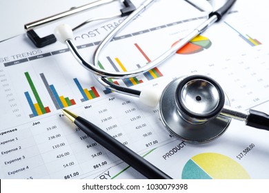 Stethoscope  Charts   Graphs paper  Saving stack coins money  globe   credit card  Finance  Account  Statistics  Investment  Analytic research data economy   Business company meeting concept 
