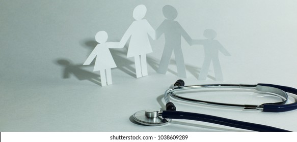 Stethoscope And The Family Paper Doll.the Concept Of Health.