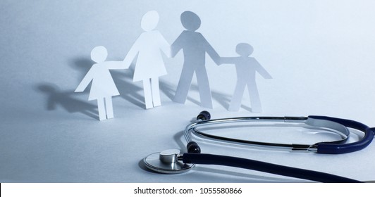 Stethoscope And The Family Paper Doll.the Concept Of Health.