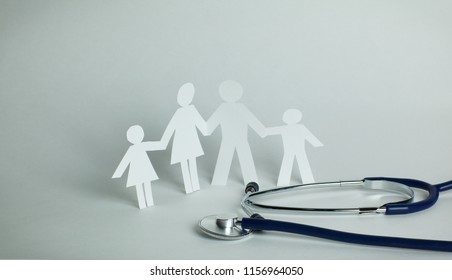 Stethoscope And The Family Paper Doll.the Concept Of Health.