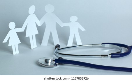 Stethoscope And The Family Paper Doll.the Concept Of Health.