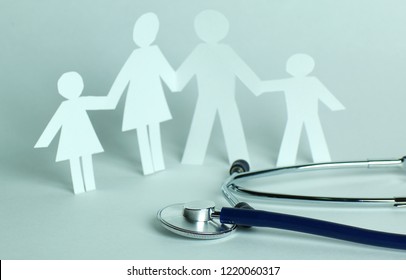 Stethoscope And The Family Paper Doll.the Concept Of Health.