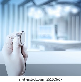 a stethoscope in the hands and Empty table and blurred background for medical product presentation