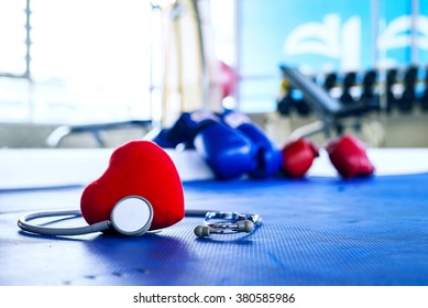 Stethoscope And Heart In Fitness Centre Concept Exercising, Healthy Lifestyle.