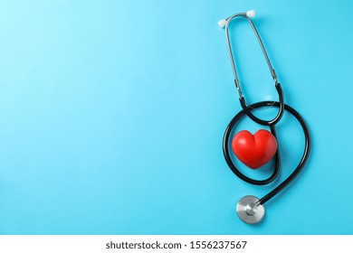 Stethoscope And Heart On Blue Background, Space For Text. Healthcare