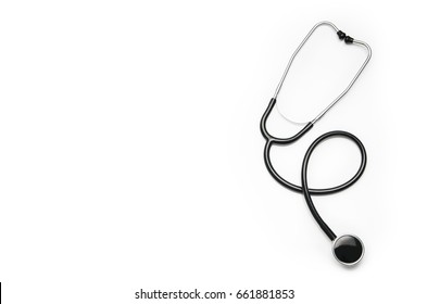 Stethoscope Isolated On White Background. Sterile Doctors Office Desk. Medical Accessories On A White Table Background With Copy Space Around Products. Photo Taken From Above.