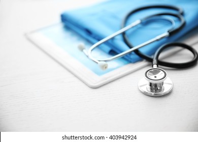 Stethoscope and medical equipment on a light blue background