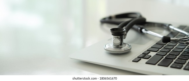 Stethoscope medical on laptop keyboard. computer repair or maintenance, doctor computer concepts.