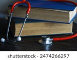 Stethoscope and Medical Textbooks on Wooden Desk - Healthcare and Education Concept