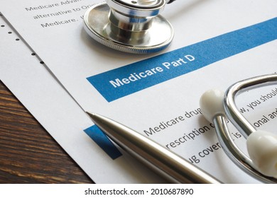 Stethoscope with medicare part D drug coverage info and pen. - Shutterstock ID 2010687890