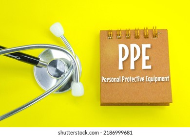 Stethoscope And Notebook With The Words Personal Protective Equipment  Healthcare Concept