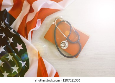 stethoscope on the background of the USA flag. health insurance scheme. national health programme