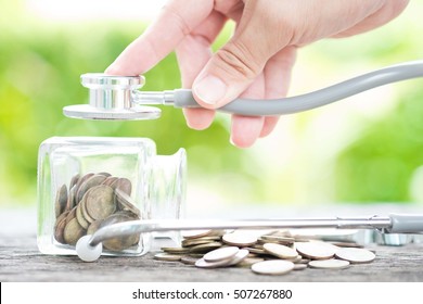 Stethoscope On Bottle And Coin On Wooden Background. Concept For Finance Health Check Or Cost Of Business, Financial Analysis, Audit Or Accounting.