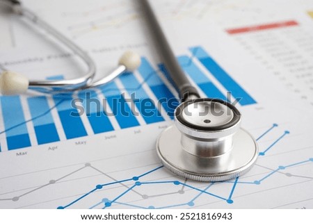 Stethoscope on chart or graph paper, Financial, account, statistics and business data medical health.
