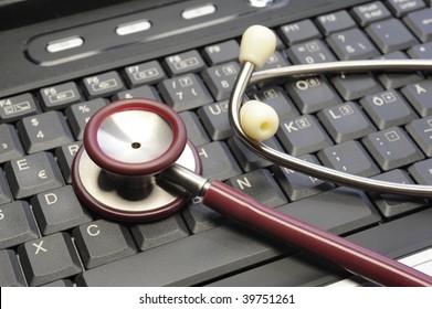 Stethoscope On A Computer Keyboard -symbolic Photo For Business And Administration In Healthcare And Medicine