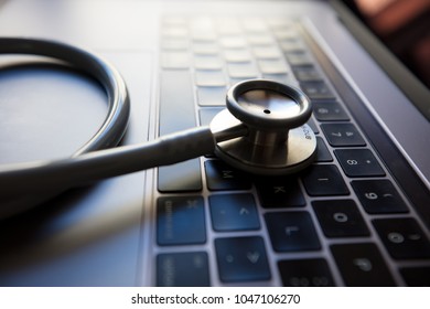 A Stethoscope On A Computer Signifying Importance Of Health Or Security In IT Sector