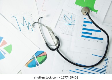 stethoscope on graph on the table background