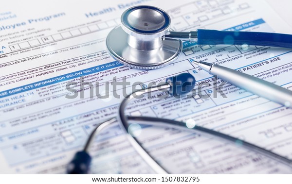 Stethoscope
on Health Insurance Document / Medical
Form