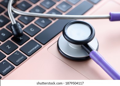 Stethoscope On Laptop Keyboard. Medical Continuing Education Courses Concept