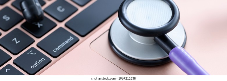 Stethoscope on laptop keyboard. Medical continuing education courses