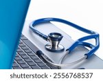 Stethoscope on a laptop medical concept 