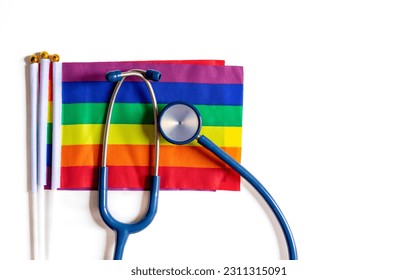 stethoscope on lgbt colorful rainbow flags,symbol of gay pride isolated on white background with copy space for text, concept of health care or medical care in lgbtq people or diverse genders - Shutterstock ID 2311315091
