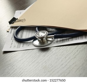 Stethoscope On Medical Billing Statement On Table