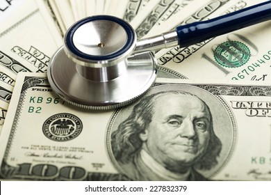 Stethoscope On Money Background - Medical Concept 