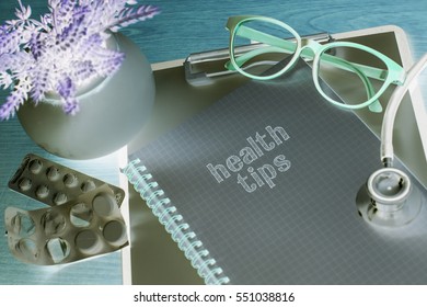 Stethoscope On Note Book With Health Tips Words As Medical Concept