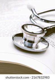 Stethoscope On A Textbooks With Shallow Depth Of Field For Medical College Concept.