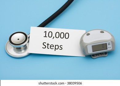 A Stethoscope And A Pedometer With A Note On A Blue Background, Walking For A Healthy Heart