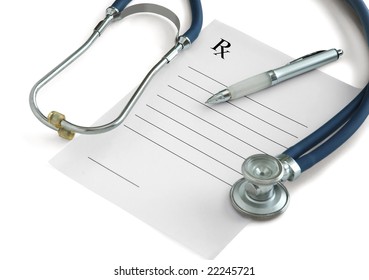 Stethoscope, A Pen And A Blank Prescription Pad On White Background
